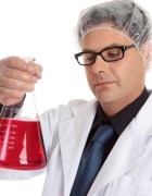 Chemist carrying large flask